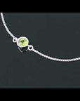 Video showcasing Bezel Set Peridot Bracelet with Adjustable Slider Clasp