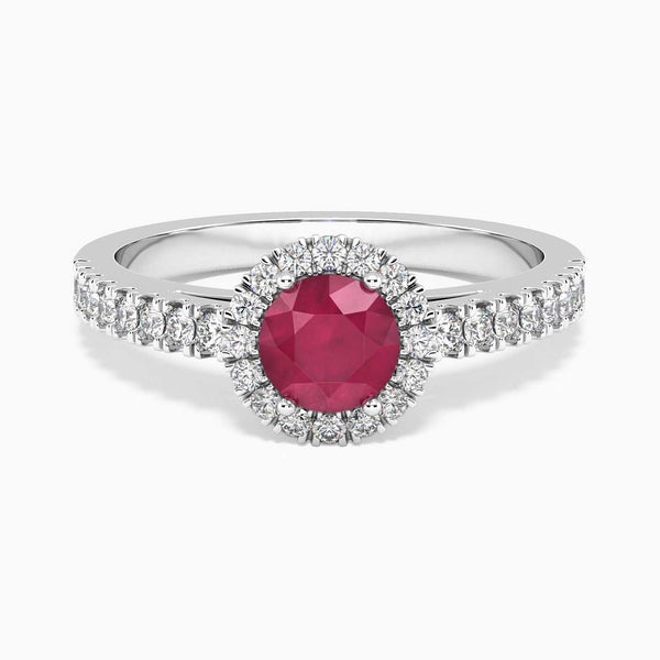 top side view of round cut ruby ring in silver