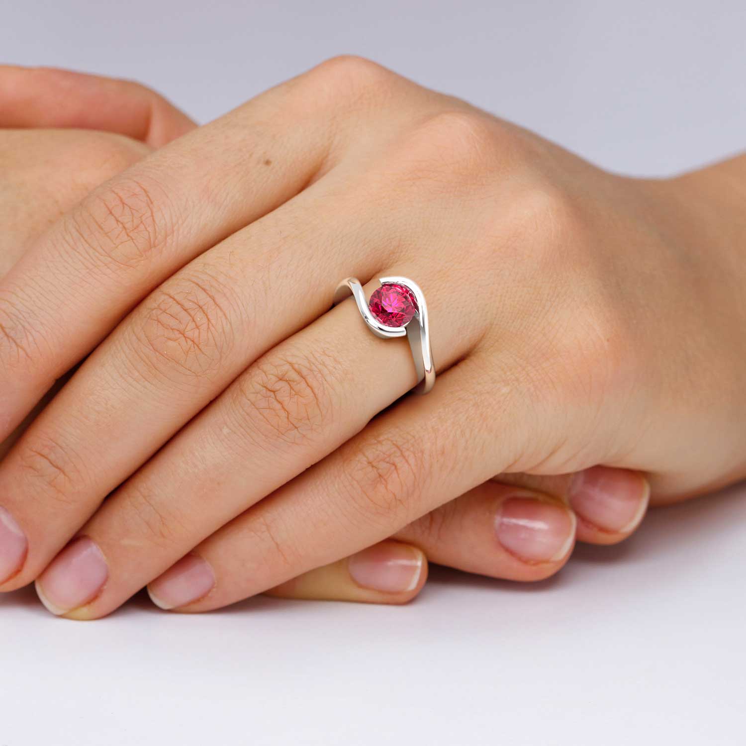 hand wearing ruby ring