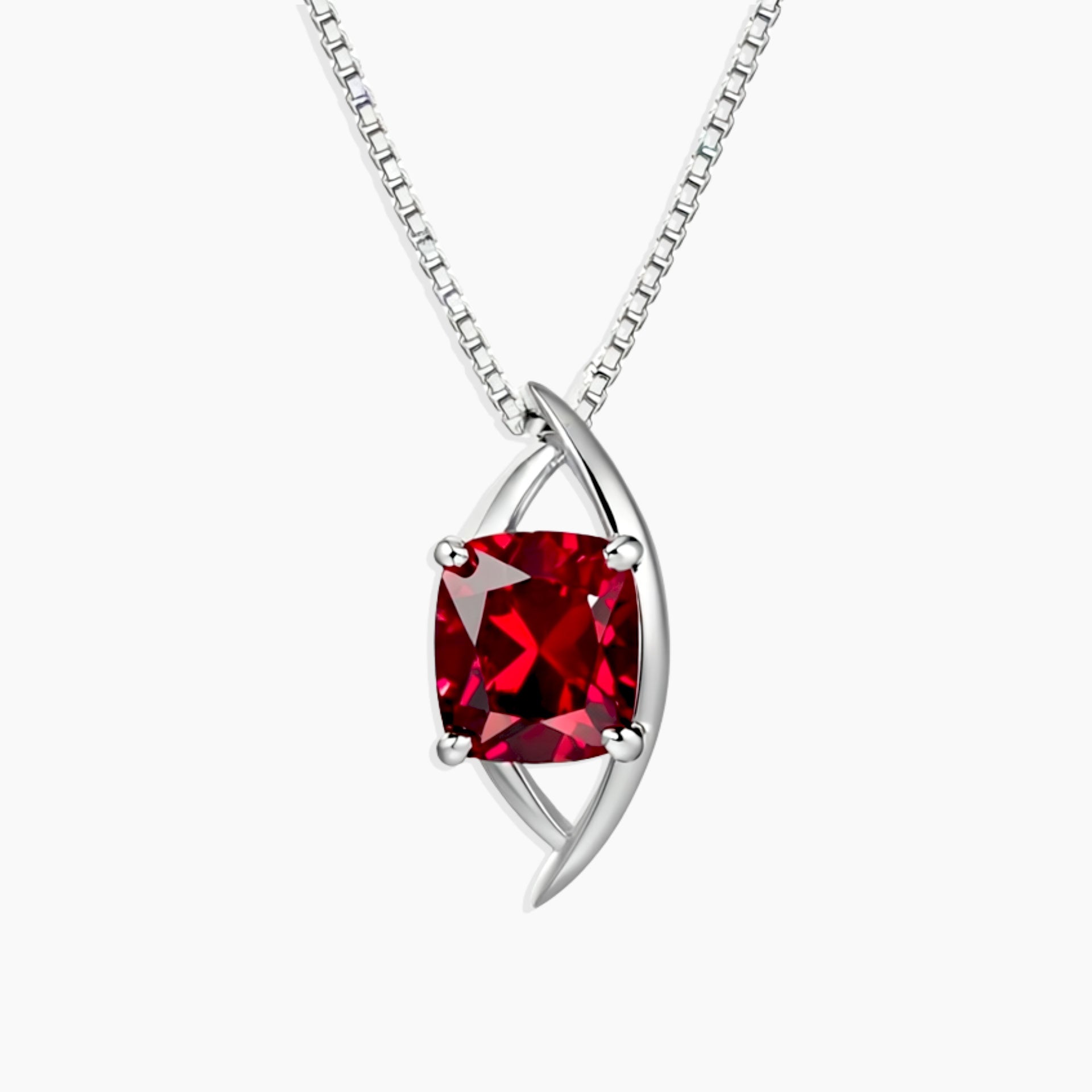 Sterling silver globe-style pendant necklace with cushion-cut created ruby in a bold red hue, set on a fine box chain.