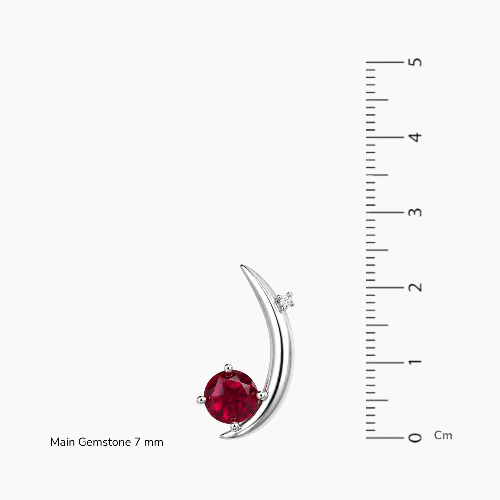 moon ruby pendant next to scale
