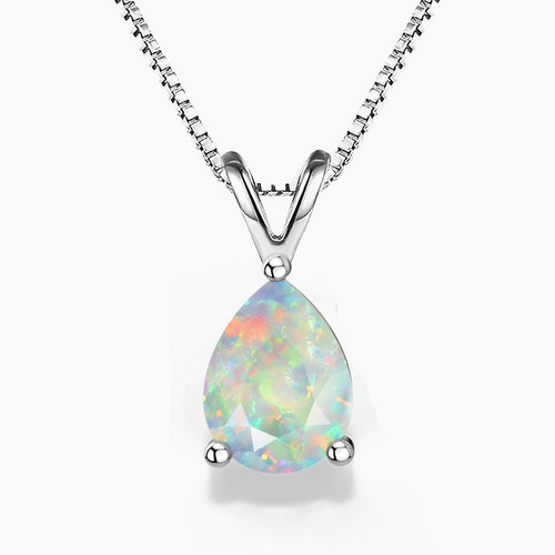 A pear-shaped white opal pendant in a three-prong sterling silver setting with a V-shaped bail, suspended from a delicate silver box chain on a white background; the opal displays a soft play-of-color with pastel flashes of green, pink, and blue.
