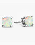 Pair of opal stud earrings on a white background