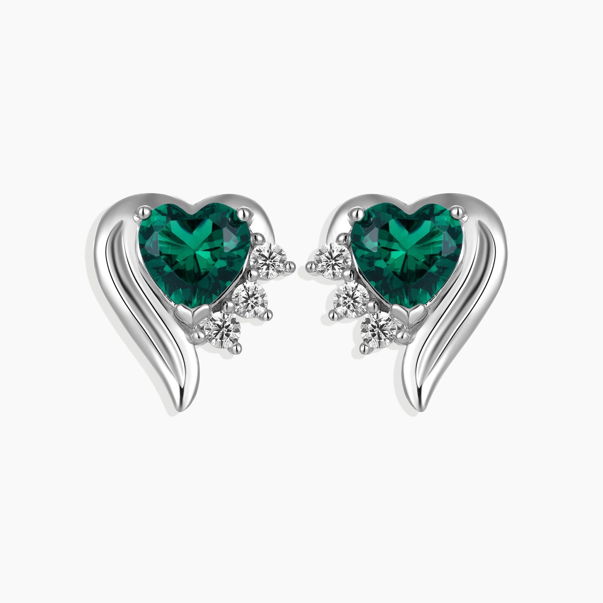 Front view of silver emerald heart shape stud earrings