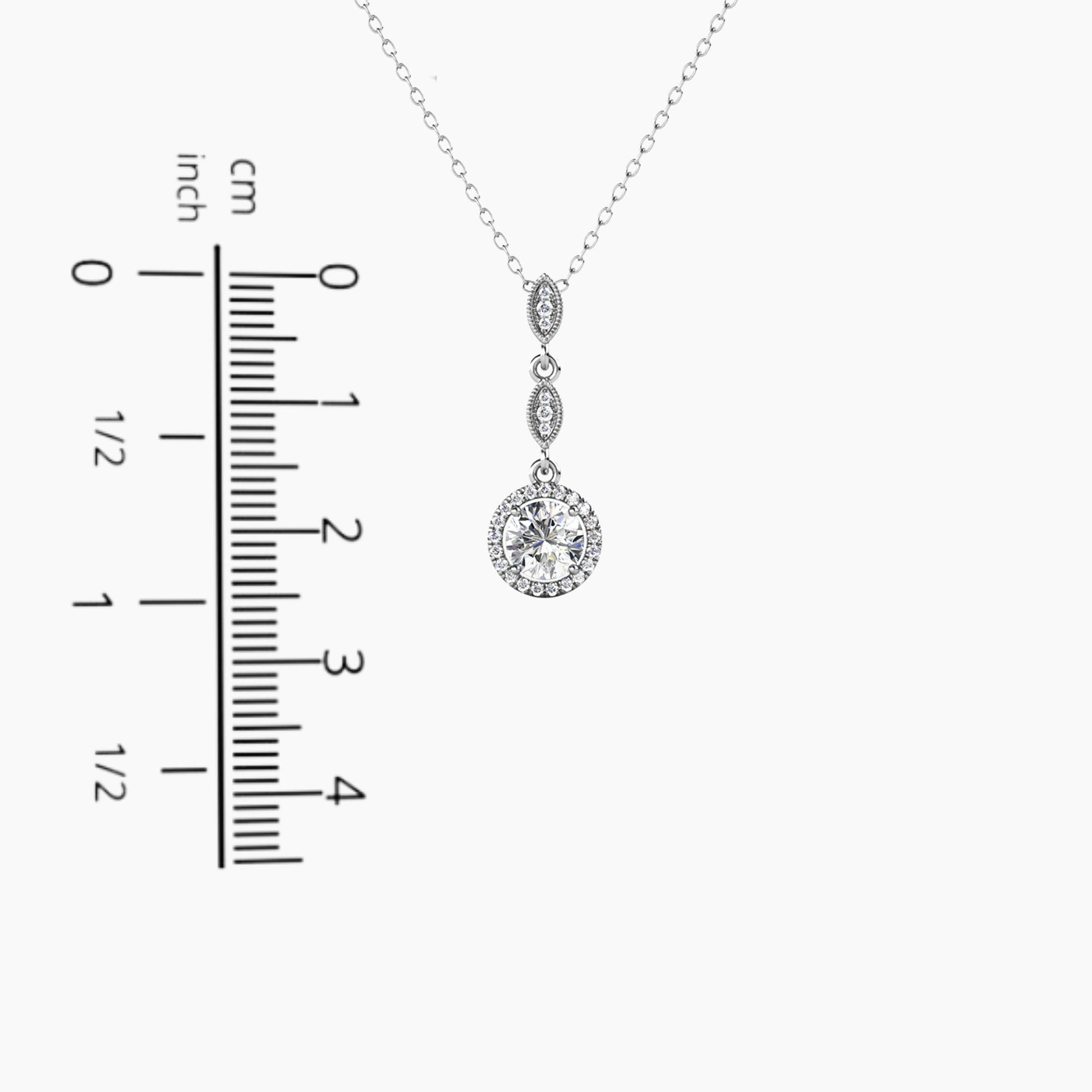 Moissanite 1ct. Etonnante Pendant Necklace displayed next to a scale, providing an accurate representation of its size and dimensions.