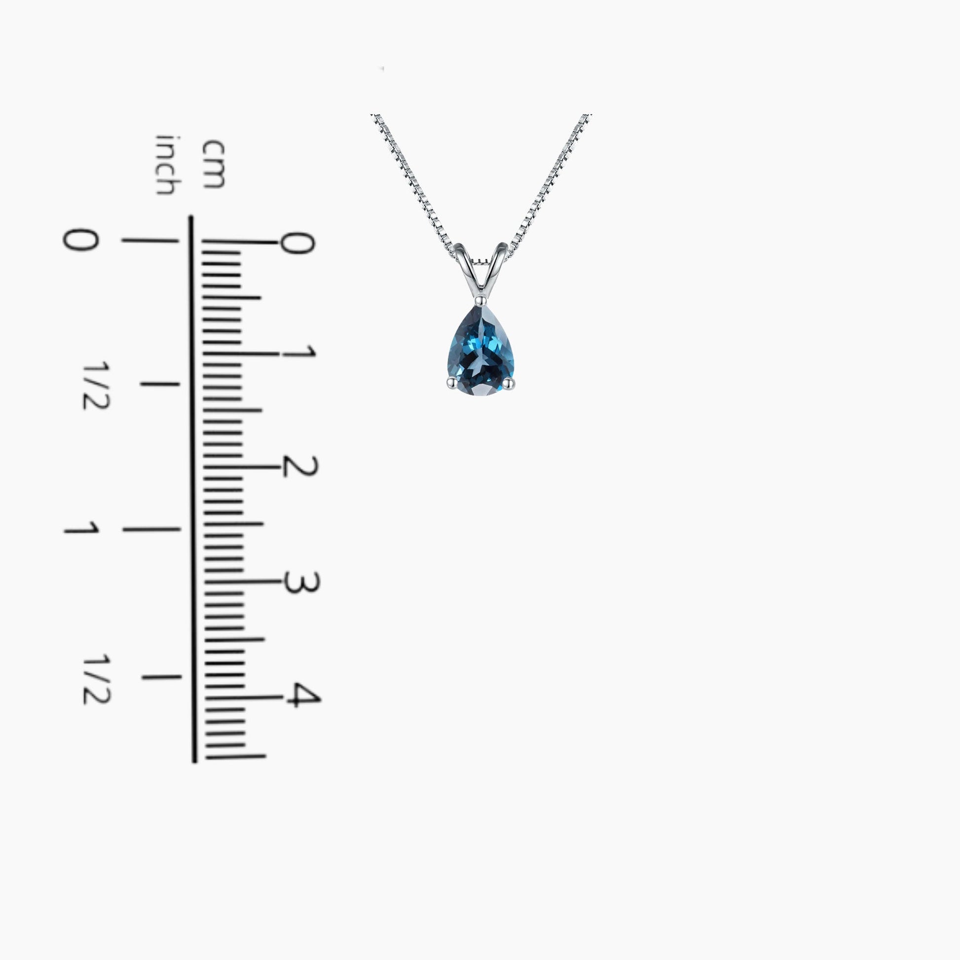 Pear Cut London Blue Topaz Pendant displayed next to a scale for size comparison