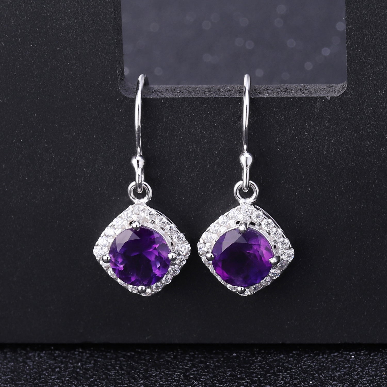 amethyst earring with dark background