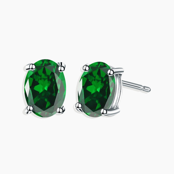 Front view of silver emerald oval cut stud earrings