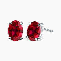  Sterling Silver Oval Cut Ruby Stud Earrings - Timeless elegance, captivating beauty.