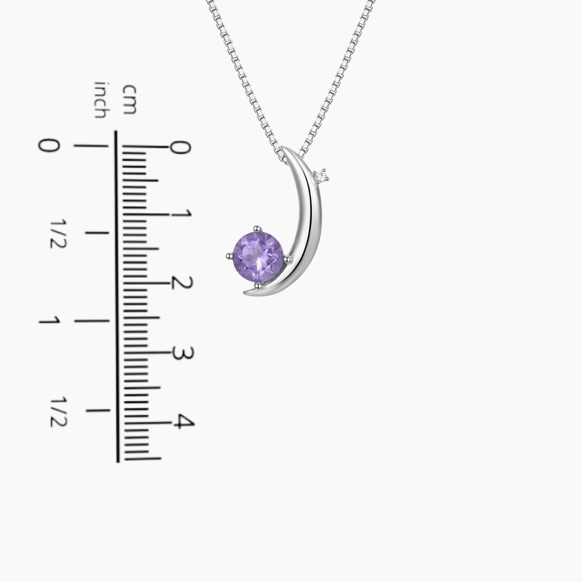 moon necklace in reference to a scale
