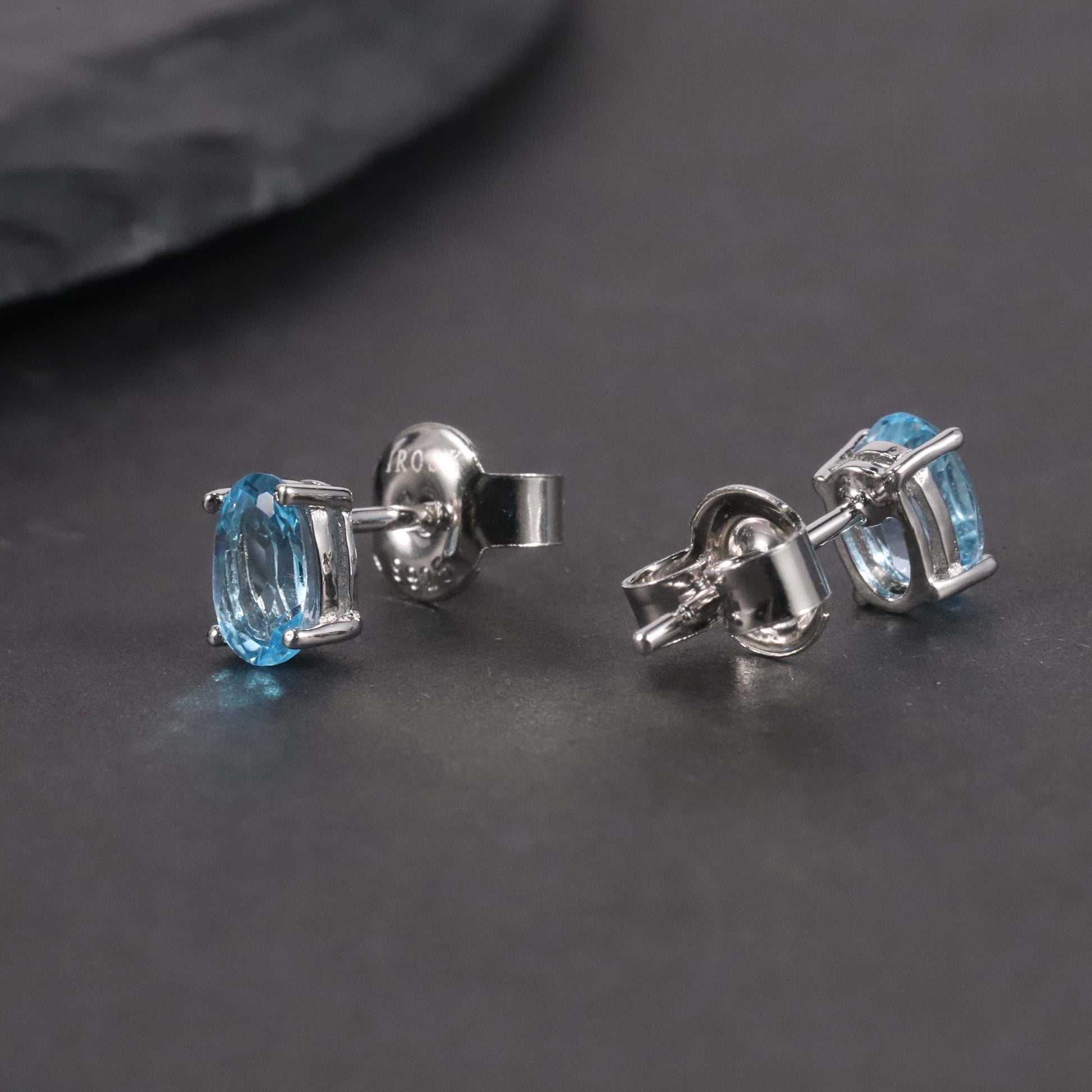 Side view of Swiss Blue Oval Cut Earrings