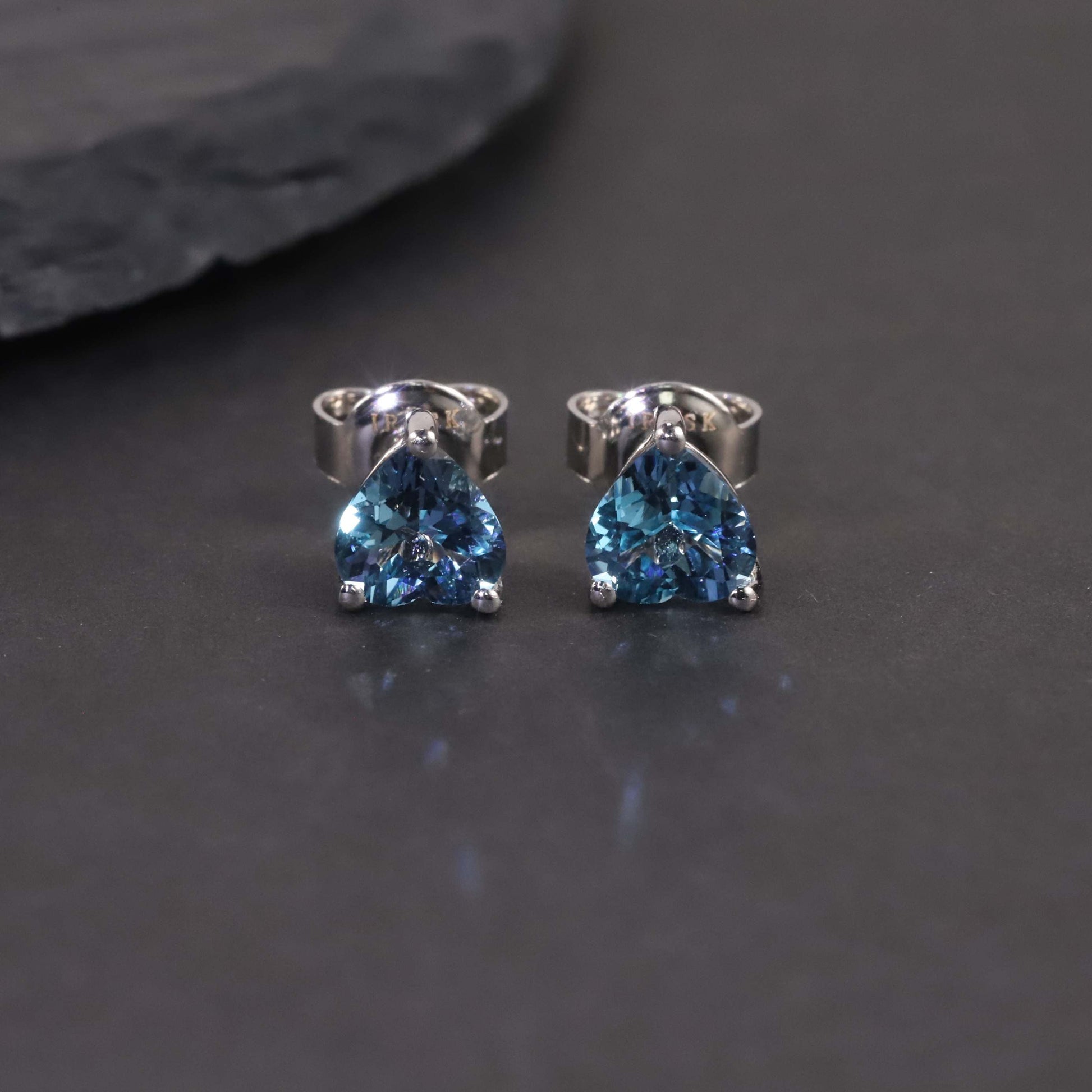 view on dark background of Heart-Shaped London Blue Topaz Stud Earrings