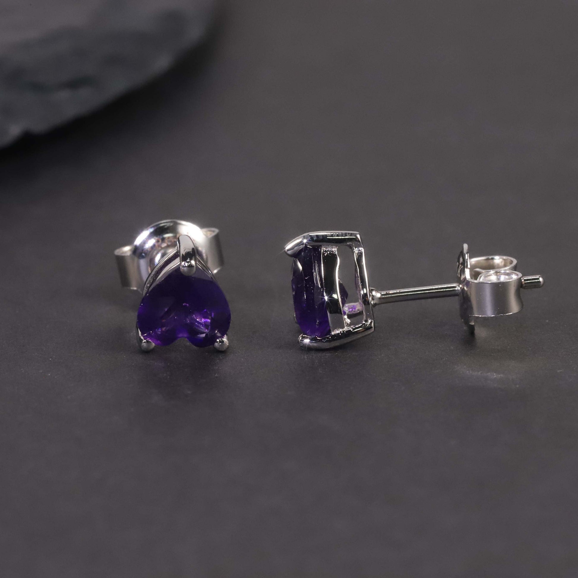 front and side view of amethyst heart studs