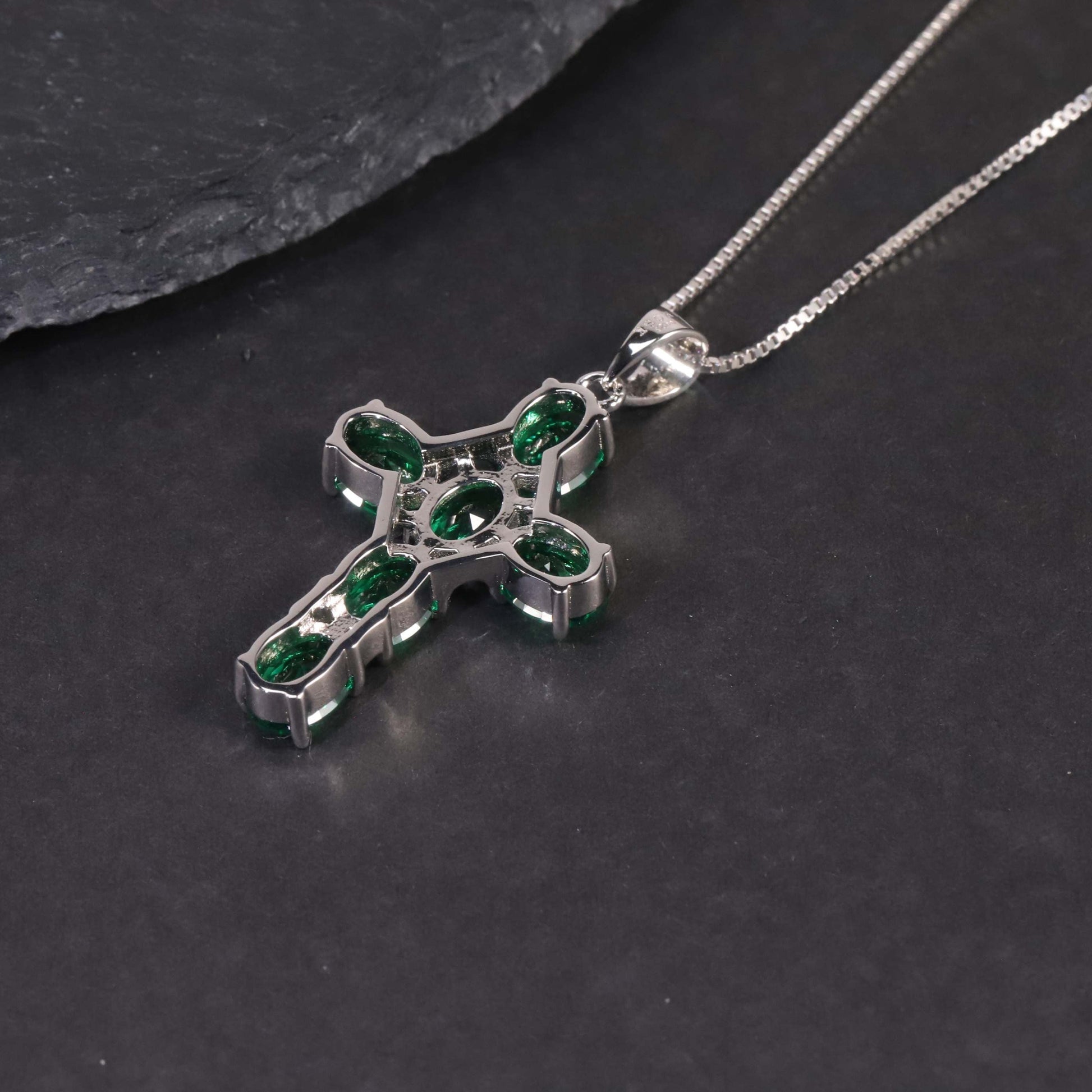 backside of emerald cross pendant