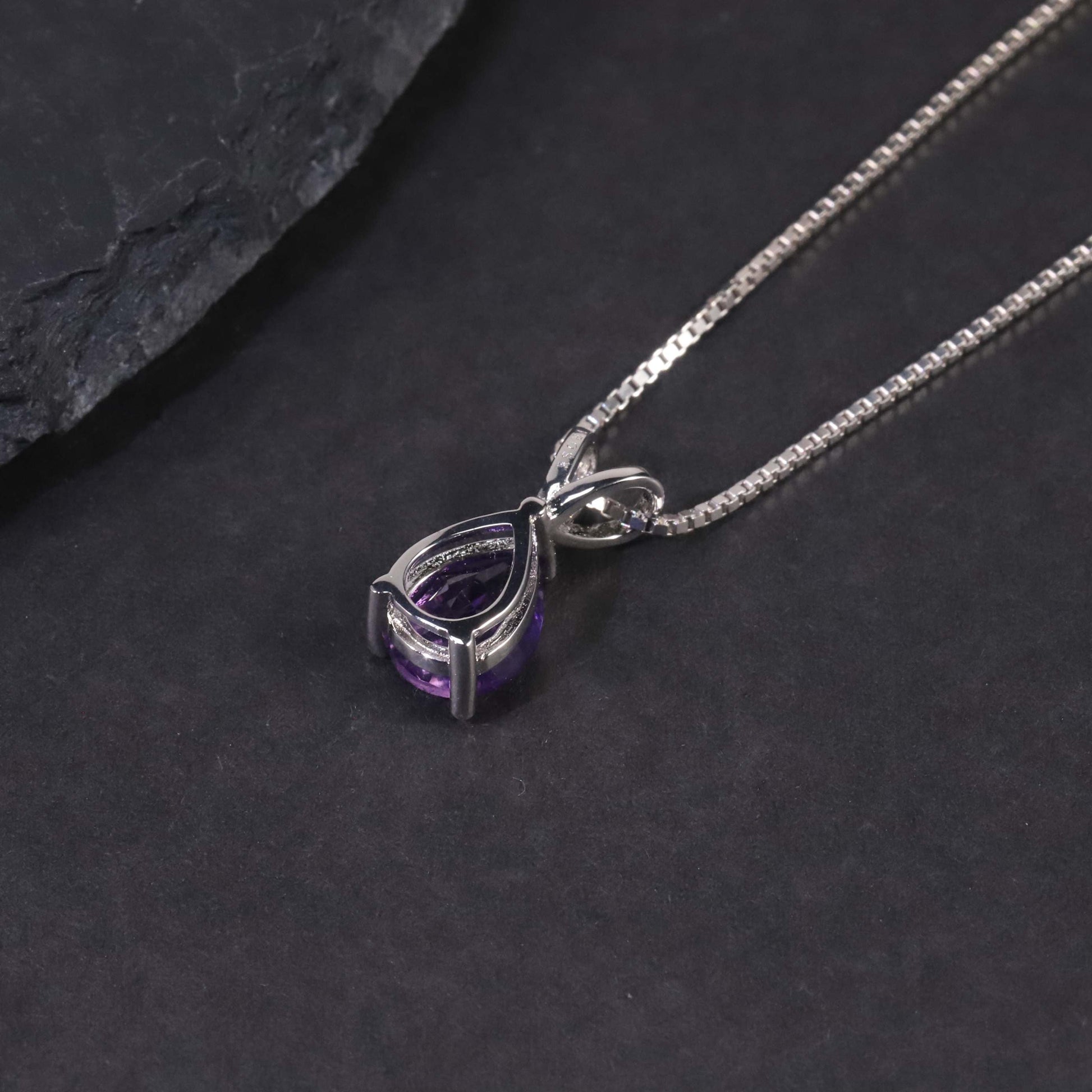 Back view of the Pear Amethyst Pendant, showcasing the smooth and polished finish of the sterling silver setting.