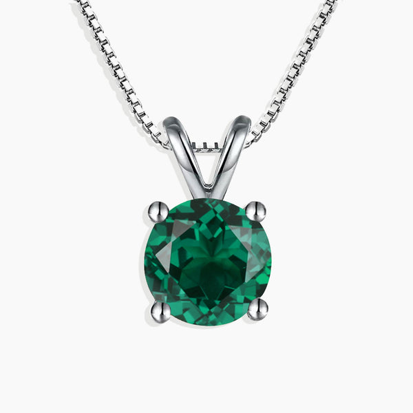 Front view of silver round cut emerald pendant