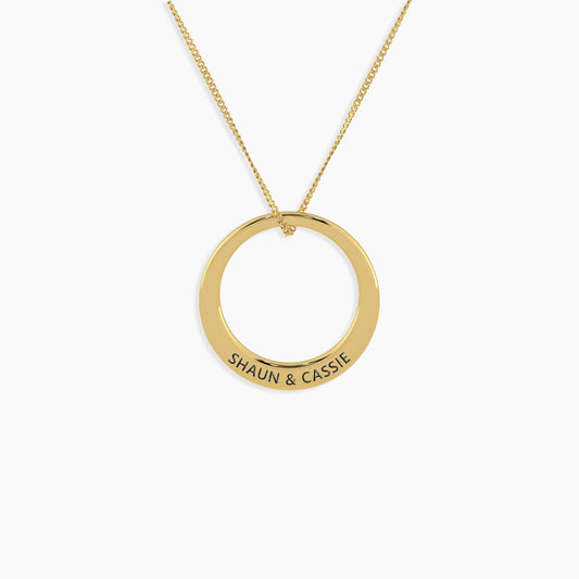 Front view of the Circle of Serenity Small Pendant, showcasing its disc-shaped design, rhodium and gold plating, and custom name engraving, making it the ideal gift for her in Australia.